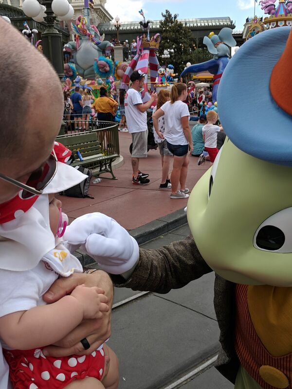 Meeting Jiminy Cricket at the Festival of Fantasy parade